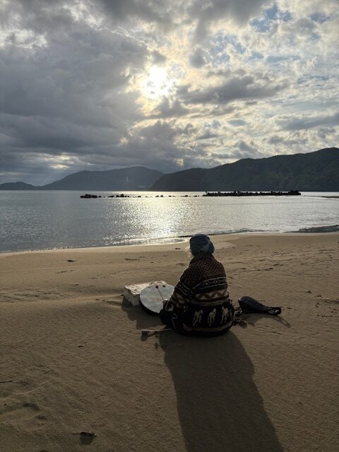Every morning, prayer drums at Yura Beach